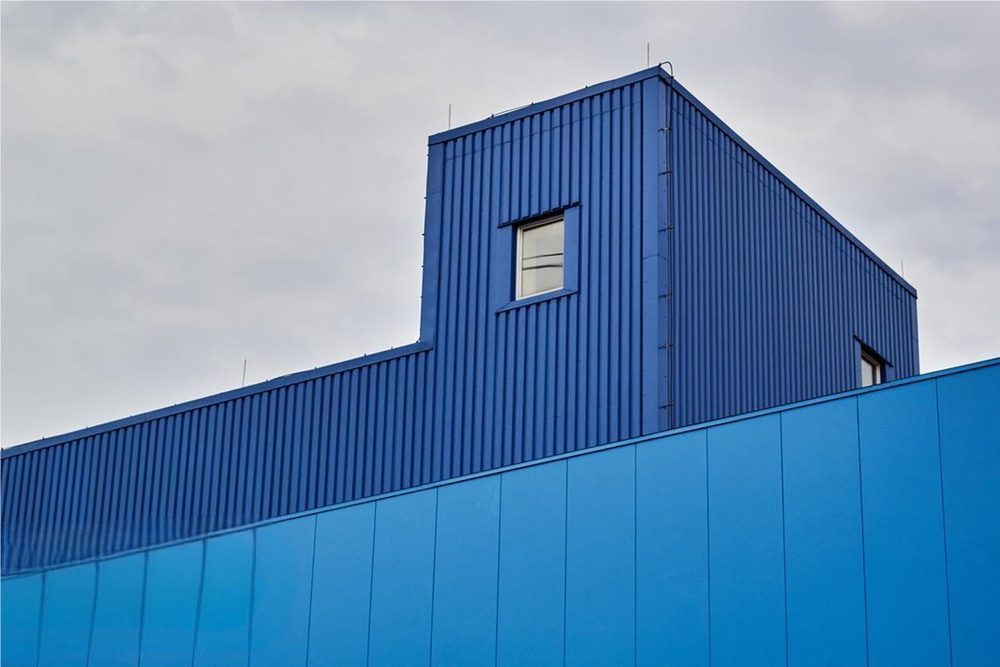 Blue sandwich panel warehouse facade